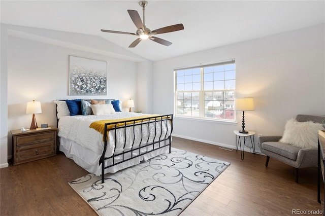 bedroom with vaulted ceiling, a ceiling fan, baseboards, and wood finished floors