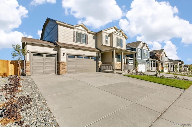 view of front of home with a porch and a garage