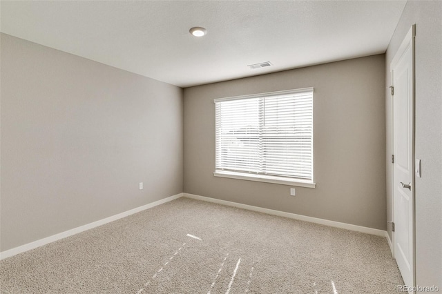 empty room featuring carpet flooring