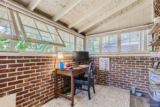 office space featuring wood ceiling, brick wall, light hardwood / wood-style floors, and vaulted ceiling with beams