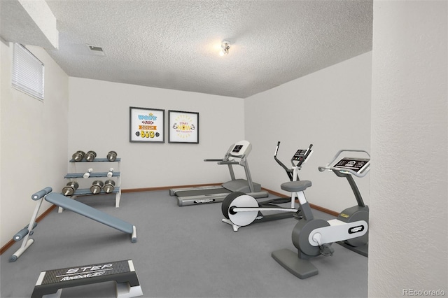 18083 E Atlantic Dr, Aurora, CO 80013 - workout room with a textured ceiling and baseboards