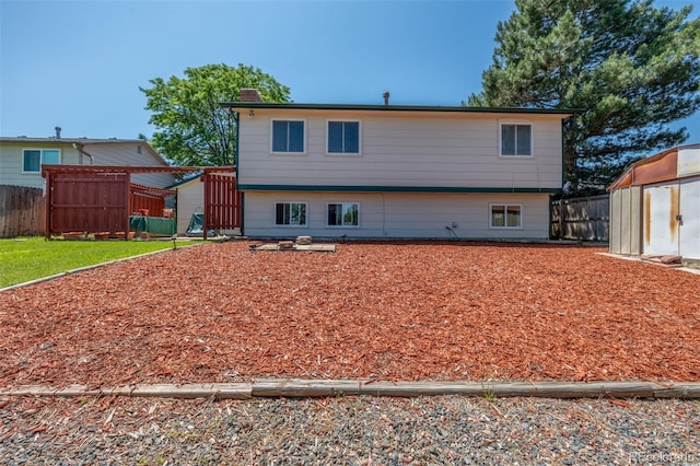 18083 E Atlantic Dr, Aurora, CO 80013 - rear view of property with a storage shed