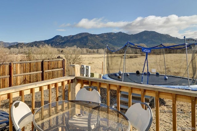 wooden deck with a mountain view