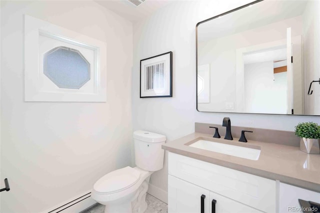 bathroom featuring toilet, baseboard heating, and vanity