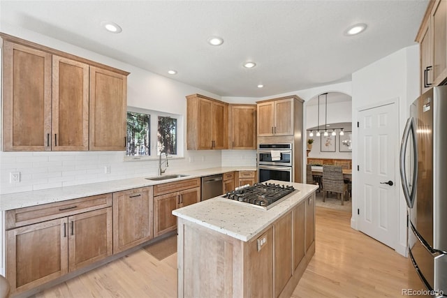 17912 Loverly Way, Monument, CO 80132 - kitchen with recessed lighting, a sink, light wood finished floors, and appliances with stainless steel finishes