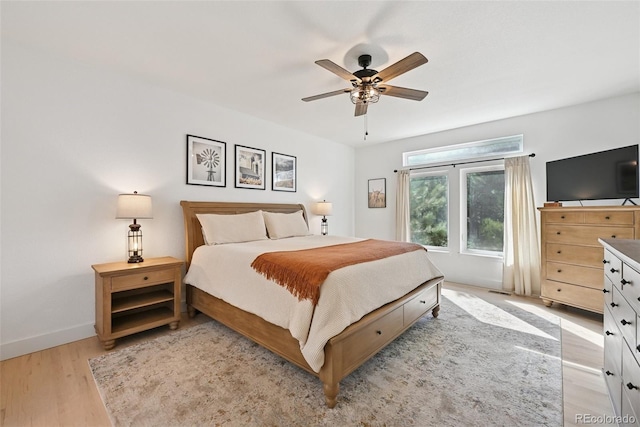 17912 Loverly Way, Monument, CO 80132 - bedroom featuring baseboards, a ceiling fan, and light wood-style flooring