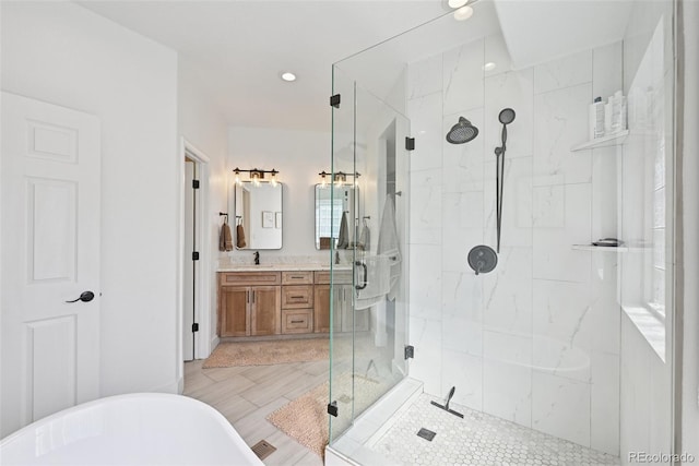 17912 Loverly Way, Monument, CO 80132 - bathroom featuring vanity, recessed lighting, a marble finish shower, and a freestanding bath