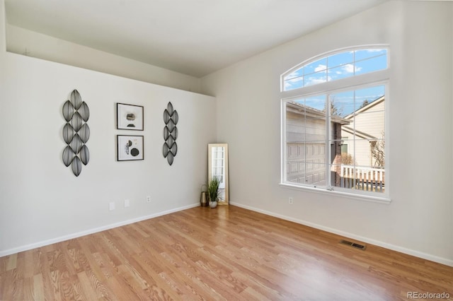 spare room featuring light hardwood / wood-style flooring