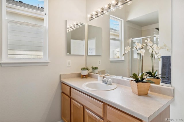 bathroom featuring vanity and walk in shower