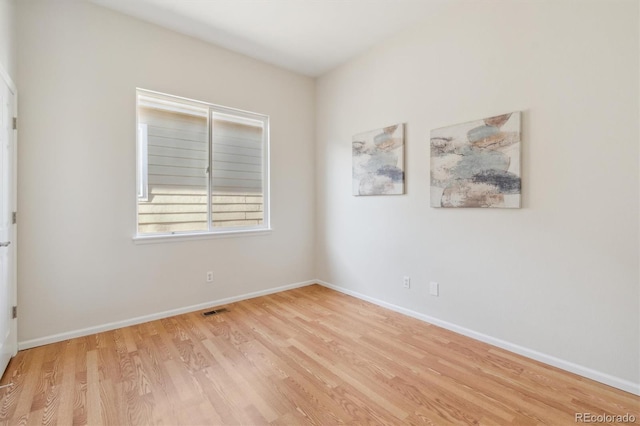 unfurnished room with light hardwood / wood-style flooring