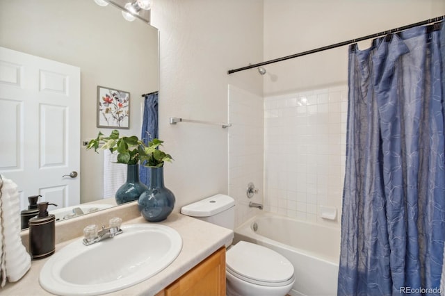 full bathroom with shower / bath combination with curtain, toilet, and vanity