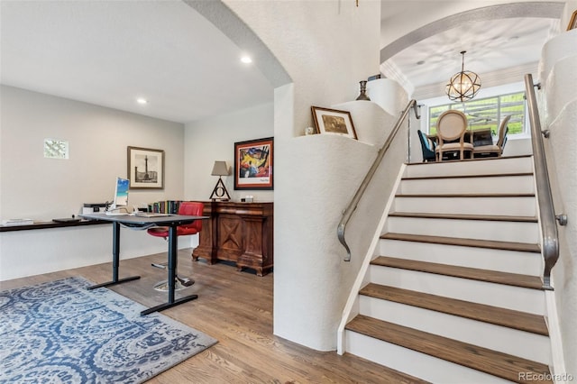 6338 Spotted Fawn Run, Littleton, CO 80125 - staircase with arched walkways, wood finished floors, and recessed lighting