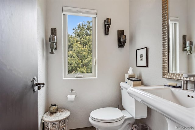 6338 Spotted Fawn Run, Littleton, CO 80125 - half bathroom featuring toilet
