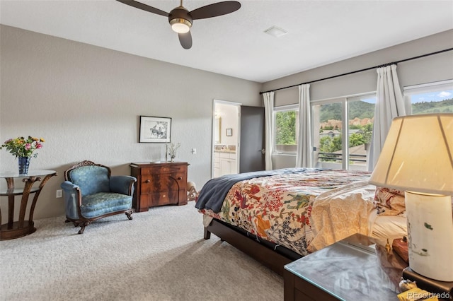 6338 Spotted Fawn Run, Littleton, CO 80125 - bedroom with carpet flooring, access to outside, connected bathroom, and ceiling fan