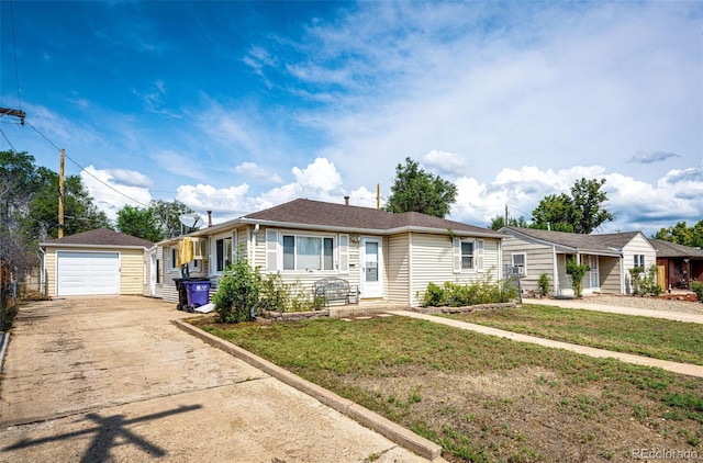 view of front facade featuring an outdoor structure, a garage, driveway, and a front yard