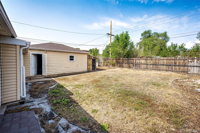 view of yard with a fenced backyard