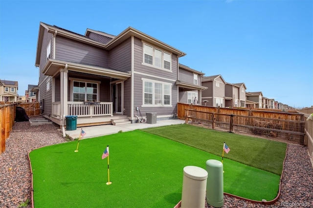 back of house featuring a patio, a fenced backyard, and cooling unit