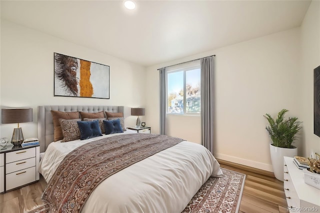 bedroom with light hardwood / wood-style floors