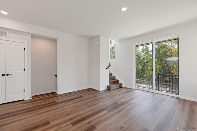 unfurnished room featuring hardwood / wood-style floors