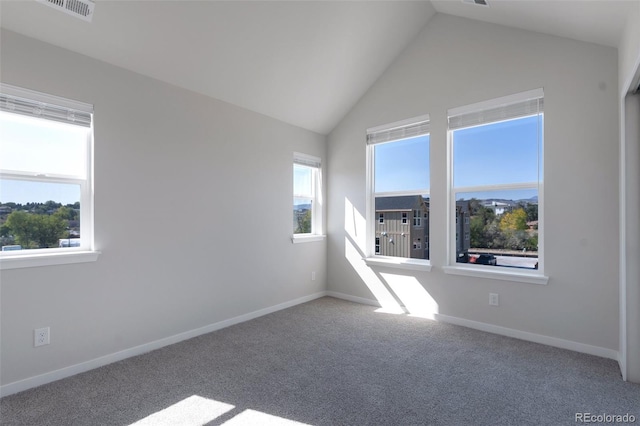 empty room with carpet and lofted ceiling