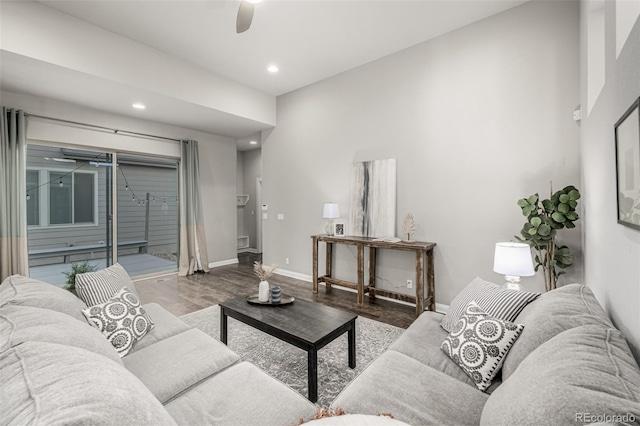 living area featuring a ceiling fan, recessed lighting, wood finished floors, and baseboards