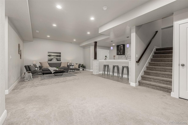 interior space with stairway, recessed lighting, and carpet