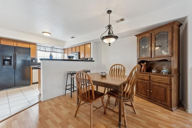 dining area featuring light hardwood / wood-style floors