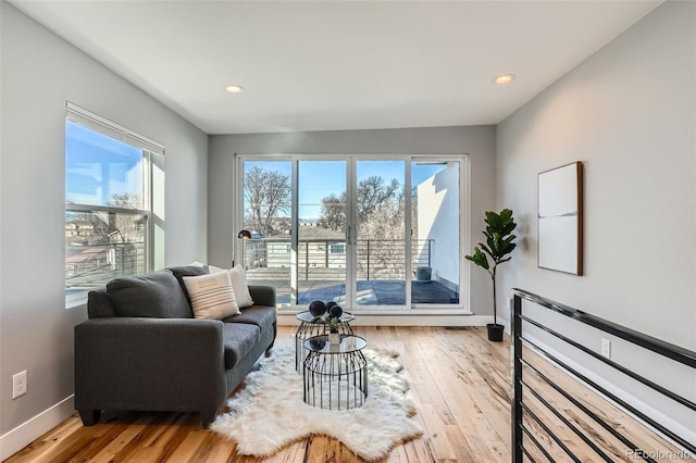 interior space featuring hardwood / wood-style floors, recessed lighting, and baseboards