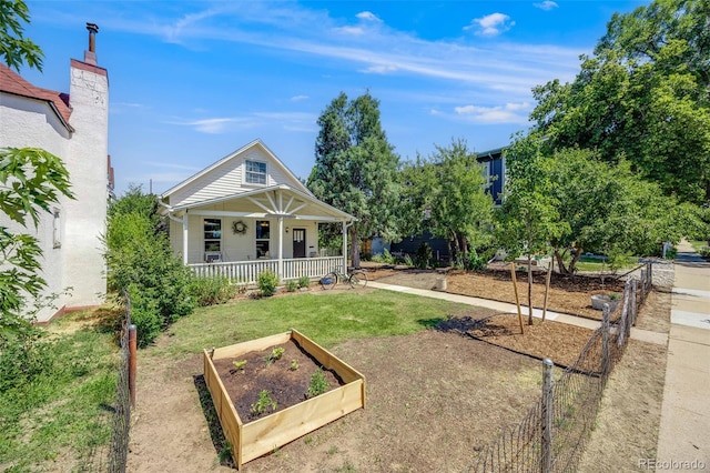 view of front of house with covered porch and a front yard