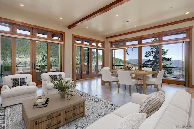 180 Outpost Ln, Evergreen, CO 80439 - living room with french doors, a mountain view, recessed lighting, and light wood-style flooring