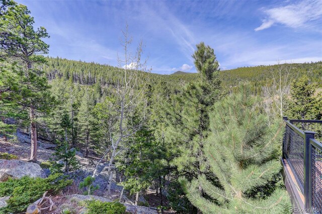180 Outpost Ln, Evergreen, CO 80439 - mountain view with a heavily wooded area