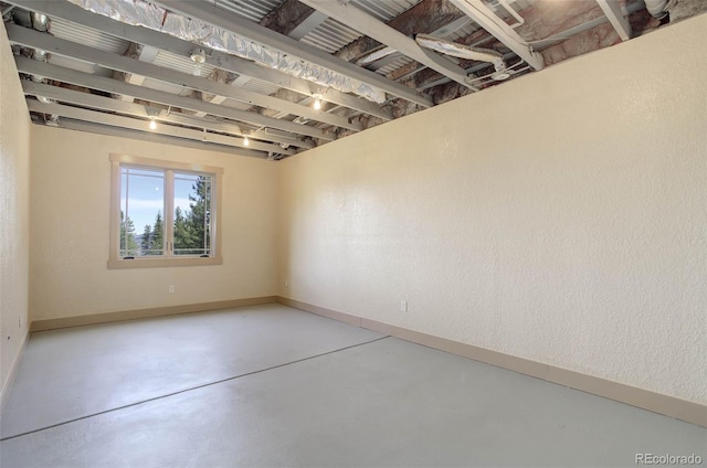 180 Outpost Ln, Evergreen, CO 80439 - unfurnished room featuring concrete floors and baseboards