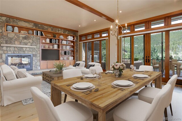 180 Outpost Ln, Evergreen, CO 80439 - dining area featuring french doors, recessed lighting, wood finished floors, and a fireplace