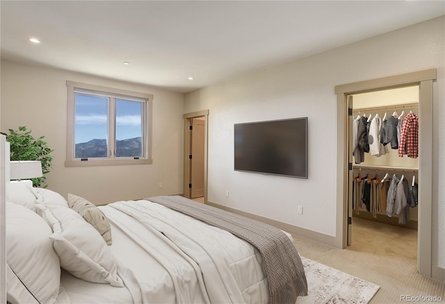 180 Outpost Ln, Evergreen, CO 80439 - bedroom with light carpet, a walk in closet, recessed lighting, and a closet