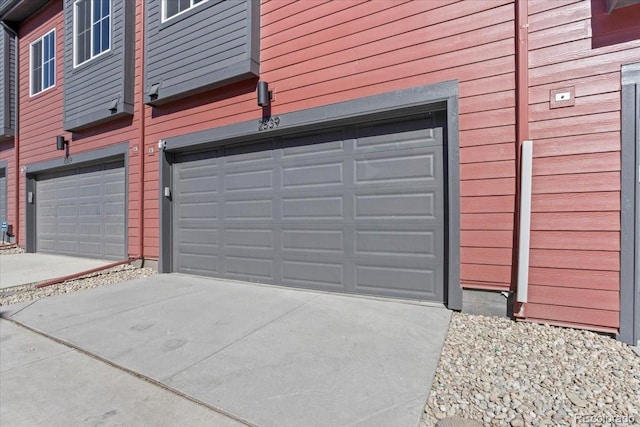 garage with concrete driveway
