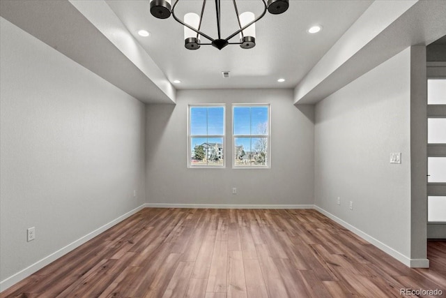 bonus room with recessed lighting, wood finished floors, baseboards, and a chandelier