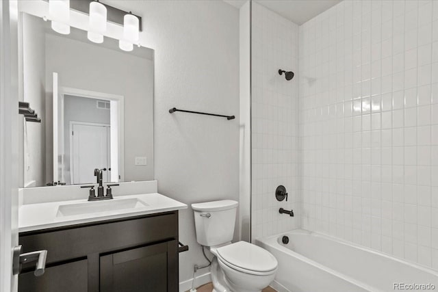 bathroom with vanity, visible vents, baseboards, tub / shower combination, and toilet