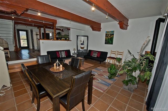 10 Baca Meadows Townhome Rd, Crestone, CO 81131 - dining space with beam ceiling, tile patterned flooring, and rail lighting