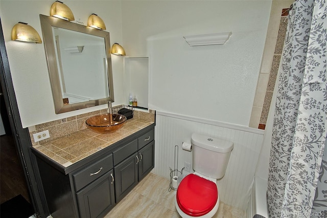 10 Baca Meadows Townhome Rd, Crestone, CO 81131 - bathroom featuring vanity, wainscoting, and curtained shower