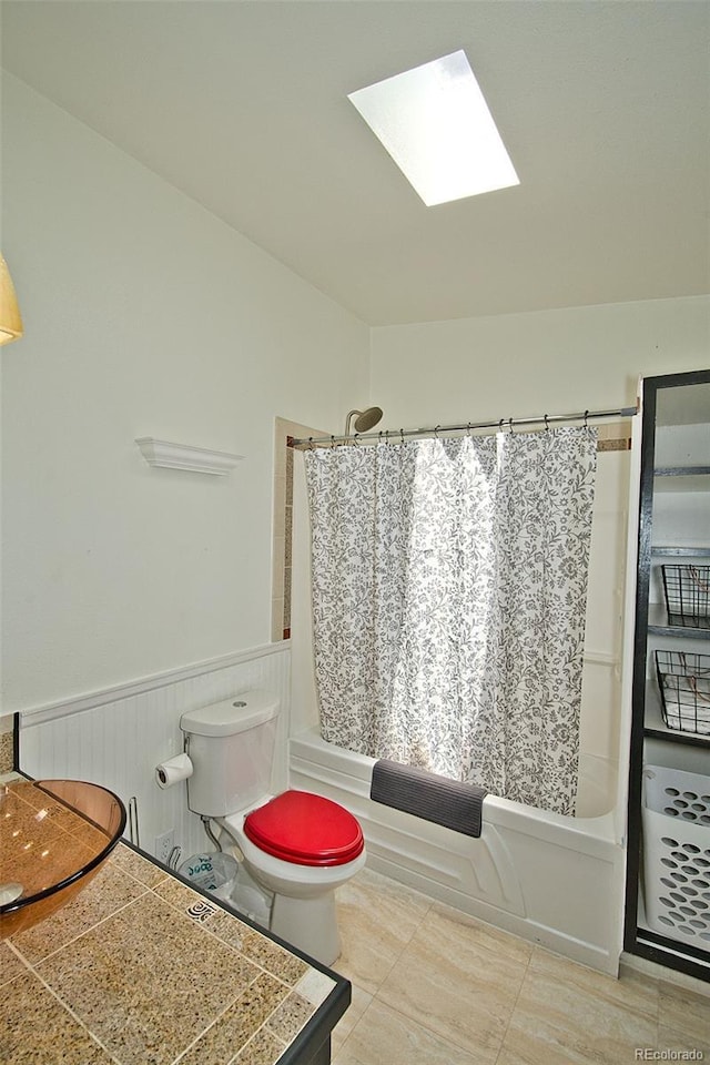 10 Baca Meadows Townhome Rd, Crestone, CO 81131 - bathroom featuring shower / tub combo, a skylight, wainscoting, and tile patterned flooring