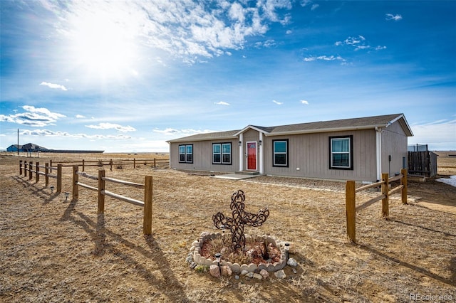 single story home with fence