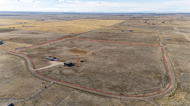 aerial view of sparsely populated area featuring property parcel outlined and a desert landscape