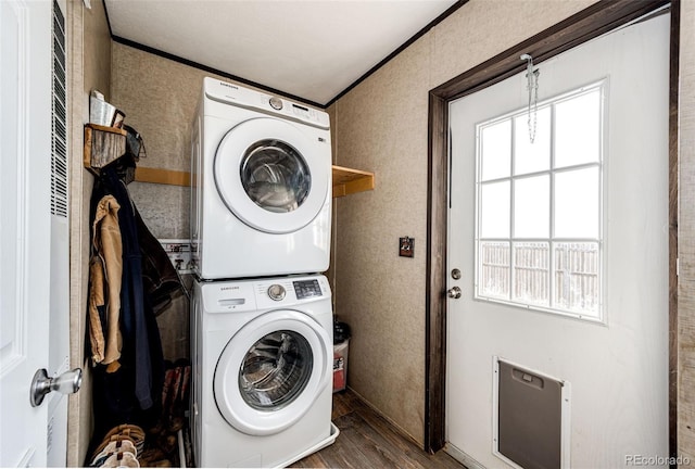 washroom featuring estacked washer and dryer, wood finished floors, plenty of natural light, and ornamental molding