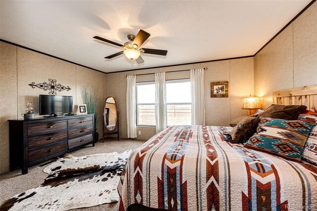 bedroom featuring crown molding, carpet, and ceiling fan