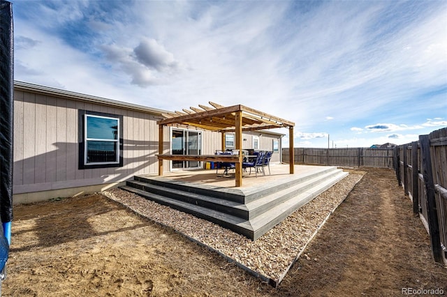 wooden terrace featuring a pergola and a fenced backyard
