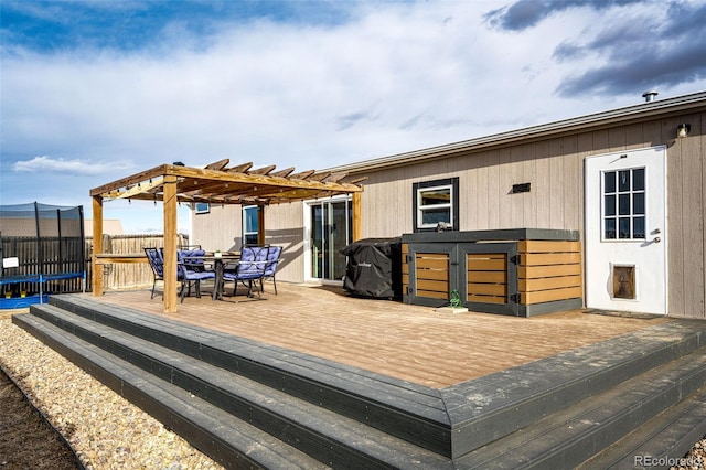 wooden terrace with a pergola, outdoor dining area, and fence
