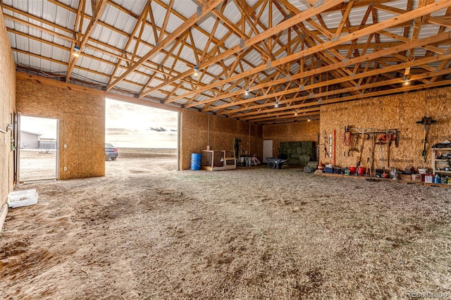 misc room with high vaulted ceiling
