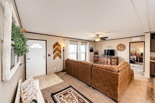 6201 S Vanderhoof St, Bennett, CO 80102 - living area with a ceiling fan, healthy amount of natural light, and light colored carpet