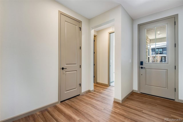 24593 E 34th Ave, Aurora, CO 80019 - doorway featuring light wood-style flooring and baseboards