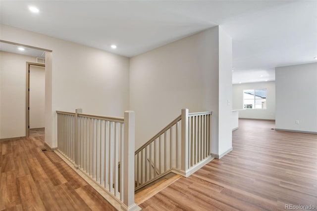 24593 E 34th Ave, Aurora, CO 80019 - corridor with an upstairs landing, wood finished floors, and recessed lighting